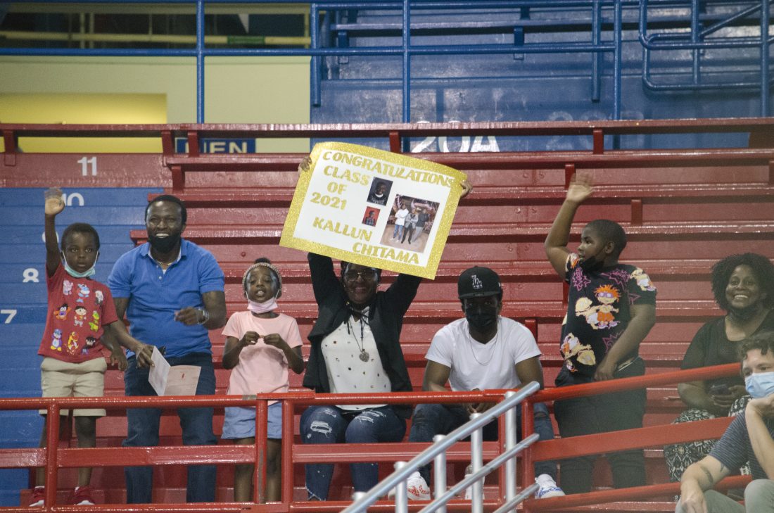 A group of guests cheer on LHS senior Kallun Chitama